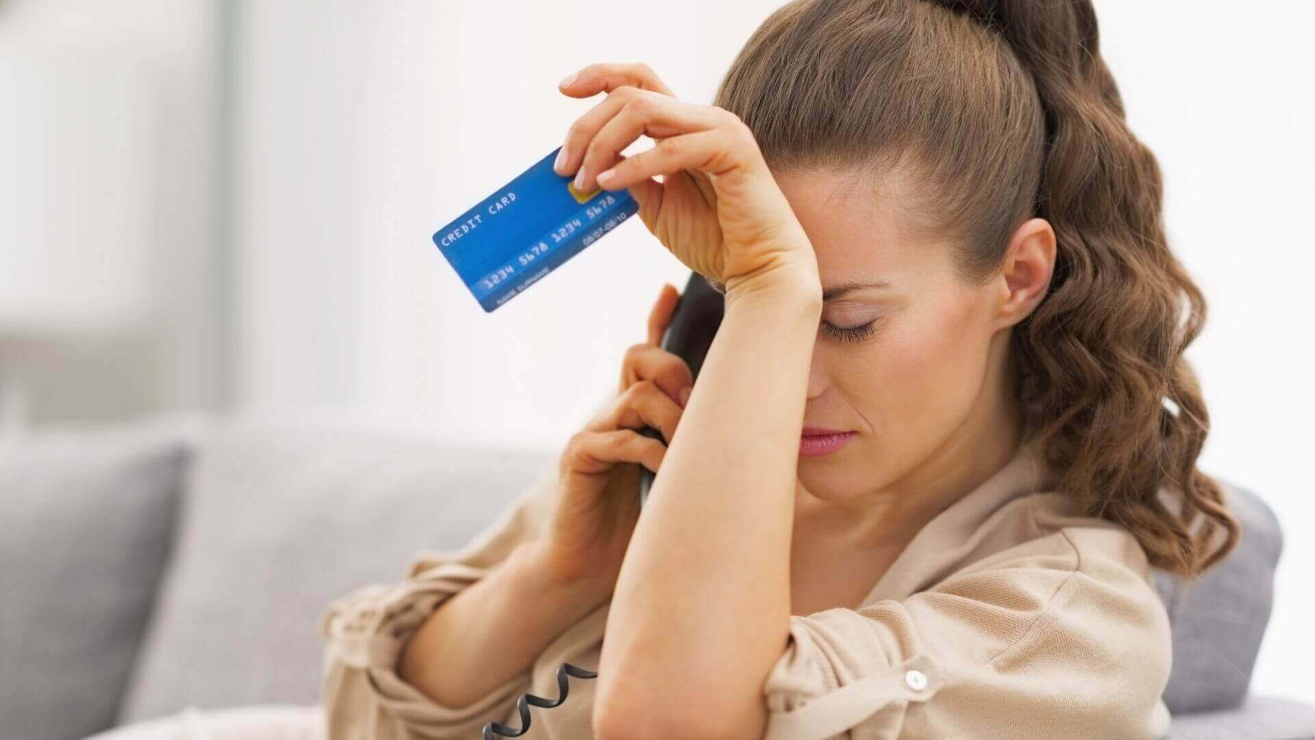 Person checking an unknown card charge on a bank statement
